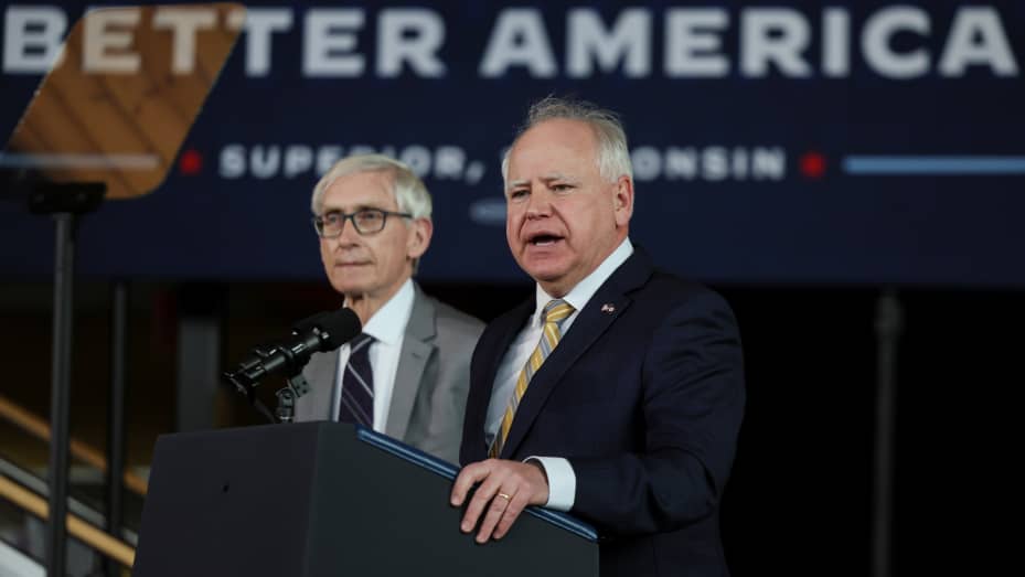 Minnesota Governor Tim Walz speaks next to Wisconsin Governor Tony Evers at Yellowjacket Union, at University of Wisconsin-Superior, in Superior, Wisconsin, U.S. March 2, 2022. REUTERS/Evelyn Hockstein