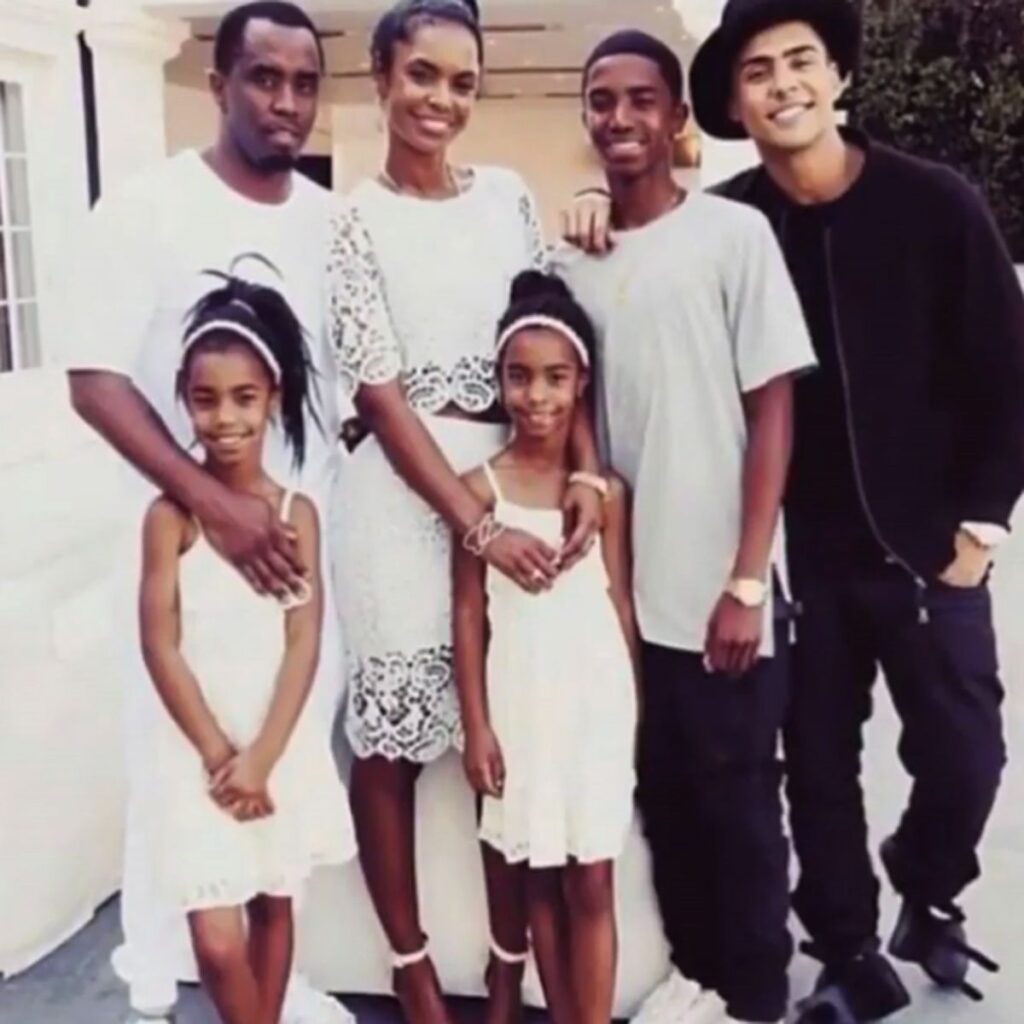 A young Sean Combs standing with his mother, illustrating his early life and family background.